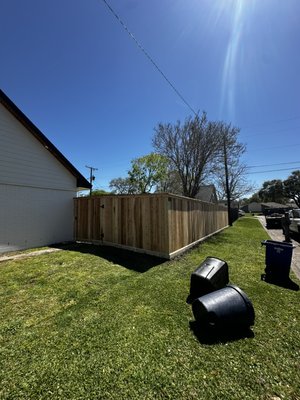 6.5’ tall cedar with cap and trim - Our crew installed 130’ of 6.5’ cedar fence with 2x6 cedar cap and 1x4 cedar trim paired with a 6’ wide galvanized gate frame hinged on a 3x3x10’ steel post.