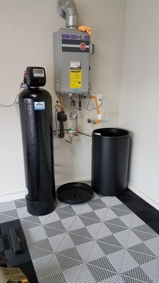 Mighty Vortech Conditioner/Softener Installation with 5 Stage Reverse Osmosis and Matching Faucets - Our Mighty Vortech is installed at our new customers new home. This system offers conditioned and softened water 24/7 throughout the home. The system absorbs hard water and chlorine for more enjoyable water for appliances, clothes, showers, faucets and softer skin. This system is more efficient and uses 30% less water and salt than the average systems our competitors sell. Our 5 Stage Reverse Osmosis is installed and located under the kitchen sink with options of faucet finishes to make sure the kitchen area looks clean and flush. This system is also a 1-1 system, so less wasteful. In most cases we can connect the reverse osmosis at no extra charge to the ice maker line under the sink for cleaner water and ice cubes at the fridge Mighty Vortech Conditioner/Softener Installation with 5 Stage Reverse Osmosis and Matching Faucets - Our Mighty Vortech is installed at our new customers new home. This system offers conditioned and softened water 24/7 throughout the home. The system absorbs hard water and chlorine for more enjoyable water for appliances, clothes, showers, faucets and softer skin. This system is more efficient and uses 30% less water and salt than the average systems our competitors sell. Our 5 Stage Reverse Osmosis is installed and located under the kitchen sink with options of faucet finishes to make sure the kitchen area looks clean and flush. This system is also a 1-1 system, so less wasteful. In most cases we can connect the reverse osmosis at no extra charge to the ice maker line under the sink for cleaner water and ice cubes at the fridge