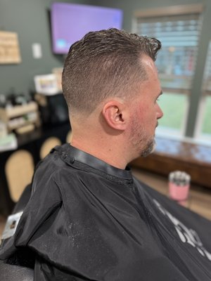Let me pamper you - The classic haircut that never goes out of style is the timeless "Short Back and Sides." This haircut is known for its neatness, elegance, and adaptability to almost any face shape or hair texture.

Key Features:
Short Back and Sides: The hair is clipped short on the back and sides, providing a clean and sharp look that highlights the natural contours of the head.
Top Length Variation: The top can be left slightly longer to allow for styling versatility, whether slicked back, side-parted, or left with some natural wave.
Tapered Finish: The transition from longer hair on top to shorter hair on the sides and back is done with precision, ensuring a smooth and gradual taper that adds to the sophistication of the cut.
Textured Layers: Adding some texture to the top with scissors can enhance the natural movement and add volume without the need for significant styling products.

Finishing Touches:
Clean Edges: Sharp, clean edges around the hairline and neckline give the haircut a polished finish.
Subtle Shine: Using a light pomade or wax can add a subtle shine to the hair, emphasizing its shape and style.
Regular Maintenance: To keep the classic look crisp and fresh, regular trims every 4-6 weeks are recommended.

Whether for a professional setting, a casual outing, or a special occasion, the classic Short Back and Sides remains a steadfast choice, reflecting both precision and beauty in its execution.￼