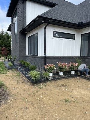 New beds, edging, plants and black slate rock install -  This install was done for a new build home! 20 yards topsoil, black, metal, edging, weed mat, new mixed assorted plants and black slate rock New beds, edging, plants and black slate rock install -  This install was done for a new build home! 20 yards topsoil, black, metal, edging, weed mat, new mixed assorted plants and black slate rock