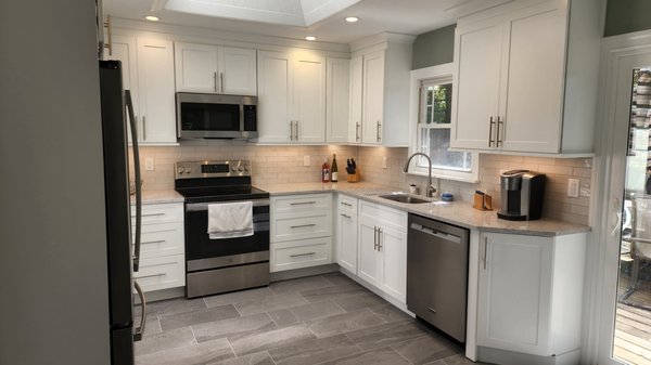 Kitchen Remodel - Kitchen remodel down to the studs. Full electrical upgrade, plumbing upgrade, all new insulation, sheetrock, cabinets, countertops and fixtures. Full tiled backsplash.