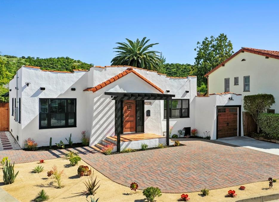5110 Bomer Dr. - Discover 5110 Bomer Drive, a beautifully reimagined Spanish-style home in trendy Highland Park. Conveniently located on a quiet street near Figueroa Boulevard's hotspots, this remodeled 1,204 sq. ft. home features an open living area, stylish kitchen with new cabinets and quartz countertops, and a serene backyard with mature fruit trees. Enjoy modern European Laminate flooring, beamed ceilings, and recessed lighting throughout. The primary bedroom suite boasts a spacious walk-in shower with stunning Spanish tiling. Step outside to a private backyard oasis with a covered patio. Nearby Debs Park, Arroyo Seco, Gold Line Metro, and the 110 freeway provide easy access to Pasadena and Downtown LA.