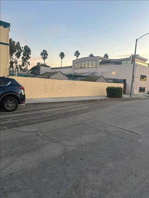 Painting the wall of a kindergarten to cover vandalism. - Painting the wall of a kindergarten to cover vandalism. Painting the wall of a kindergarten to cover vandalism. - Painting the wall of a kindergarten to cover vandalism.