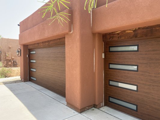 Modern Steel Woodgrain - Beautiful Clopay Modern Steel garage doors with stacked frosted windows and Woodgrain finish. Modern Steel Woodgrain - Beautiful Clopay Modern Steel garage doors with stacked frosted windows and Woodgrain finish.