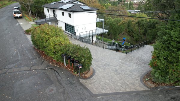 Driveway Before and after - Change the how your home welcomes you with a beautiful new paver driveway.