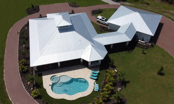 New Standing Seam Metal Roof in Myakka - Sonshine had the pleasure of installing a metal roof on this new construction home in Myakka. Union Corrugating Company manufactured the 24 gauge standing seam galvalume panels used to create this beautiful roof. A 48 watt solar power attic vent manufactured by Kennedy Skylights & Solar Ventilation was installed to help keep the garage cool. New Standing Seam Metal Roof in Myakka - Sonshine had the pleasure of installing a metal roof on this new construction home in Myakka. Union Corrugating Company manufactured the 24 gauge standing seam galvalume panels used to create this beautiful roof. A 48 watt solar power attic vent manufactured by Kennedy Skylights & Solar Ventilation was installed to help keep the garage cool.