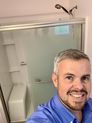 Walk-in shower installation - Remove tub shower and install Sterling walk-in shower with a sliding glass door.