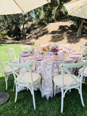 Brunch at the Farm - This cozy setup for a brunch on the farm included our white cross back chairs, fringe umbrellas, farm table, bar cart, and 72" round wooden table. Brunch at the Farm - This cozy setup for a brunch on the farm included our white cross back chairs, fringe umbrellas, farm table, bar cart, and 72" round wooden table.
