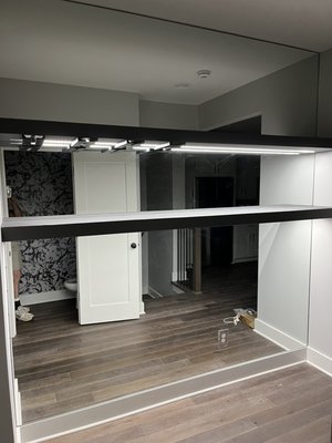 Custom Mirrors - These mirrors were measured to tightly fit the wall behind these shelves, giving the appearance of floating shelves! Custom Mirrors - These mirrors were measured to tightly fit the wall behind these shelves, giving the appearance of floating shelves!