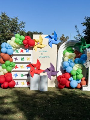 windmills - we designed this windmill and pinwheels themed birthday in a park. it was a 3 paneled custom backdrop with rainbow colors and windmills