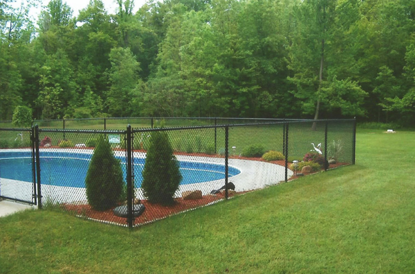 Chain Link Fencing - Chain link fences remain a popular choice for homes and businesses. It is among the most secure and durable fencing available and is widely used throughout the world. Chain link can also add a distinctive look to your property.  You can choose from the traditional galvanized fencing or have you fence powder coated with a color of your choice.  Powder coating is a process that adds a long-lasting baked enamel finish that will resist rust and keep your fencing looking new for many years.