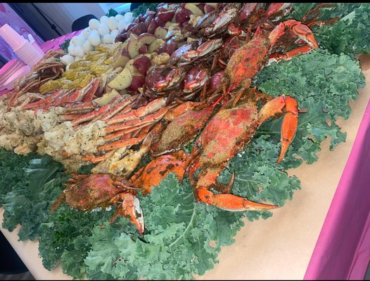 Family Seafood Table Package - This package offers a seafood table spread for various group sizes at a fixed price, providing a generous serving of seafood for a family any size.