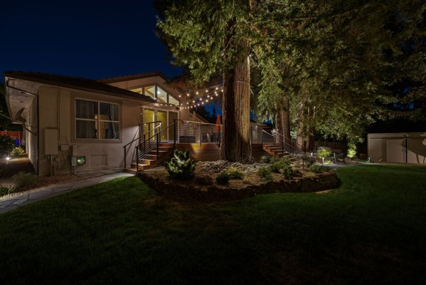 Santa Rita Awakens - The home at Santa Rita Way comes to life in every angle from the softly lit stairs that welcome you in, to the front view where warm lights dance through the trees. Each step glows with inviting elegance, and the balanced lighting from every side highlights the home’s timeless beauty. Santa Rita Awakens - The home at Santa Rita Way comes to life in every angle from the softly lit stairs that welcome you in, to the front view where warm lights dance through the trees. Each step glows with inviting elegance, and the balanced lighting from every side highlights the home’s timeless beauty.