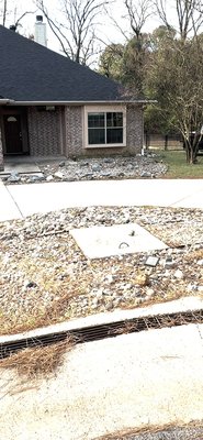 Rock and chain link fence hauled off. Dirt delivered. Gutter drainage issues fixed. Regrade slope around house and back yard. - We removed all rock around the house and a chain link fence lined with rock. We then buried all gutter drains, connecting them to the front yard drain to prevent drainage and give a more appealing look. We brought in dirt to build up the back yard to extend 10 ft from the back porch and graded a more gentle slope for back yard. Rock and chain link fence hauled off. Dirt delivered. Gutter drainage issues fixed. Regrade slope around house and back yard. - We removed all rock around the house and a chain link fence lined with rock. We then buried all gutter drains, connecting them to the front yard drain to prevent drainage and give a more appealing look. We brought in dirt to build up the back yard to extend 10 ft from the back porch and graded a more gentle slope for back yard.