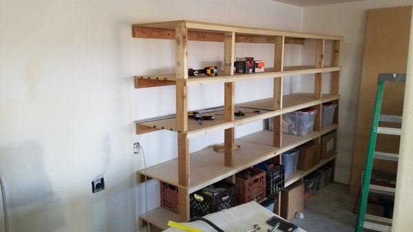 Garage Shelves - Home owner wanted shelves built into the rear of their garage. These were specifcally sized for the tots that the client used to store their stuff. Also replaced the outlets in the garage with Decor style Garage Shelves - Home owner wanted shelves built into the rear of their garage. These were specifcally sized for the tots that the client used to store their stuff. Also replaced the outlets in the garage with Decor style