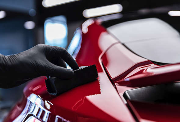 Ceramic Coating - Ceramic coating typically refers to a somewhat difficult process of applying a layer of... you guessed it... ceramic, to the car. This layer is quite thick. Thicker than any other paint sealant usually (bar a PPF). Which is why it can be hard - if you don't get it level it causes weird looking patches.
These coatings provide extreme chemical resistance - in the real world, this essentially means bird poop and tree sap won't damage paint anywhere near as easily. They make water, and to an extent, dirt, not stick to paint. This makes them easier to clean, far easier to dry, and means the car has some "self cleaning" properties (Rain can drag away a significant amount of dirt on a ceramic coated car). They're also very resistant to UV, preventing paint fade.
Their main advantage, given to them by their thickness, is that they last a very long time. They can easily last years.
Ceramic coatings are not to be confused (although it's easy to get confused) with the vast range of waxes, spray sealants, liquid sealants, etc - that contain ceramics, typically SiO2. The presence of the chemical gives the wax/spray/liquid some of the advantages of ceramic coatings, like their extreme hydrophobic properties, chemical resistance, etc - but they don't go on anywhere near as thick as a proper ceramic coating. Ceramic Coating - Ceramic coating typically refers to a somewhat difficult process of applying a layer of... you guessed it... ceramic, to the car. This layer is quite thick. Thicker than any other paint sealant usually (bar a PPF). Which is why it can be hard - if you don't get it level it causes weird looking patches.
These coatings provide extreme chemical resistance - in the real world, this essentially means bird poop and tree sap won't damage paint anywhere near as easily. They make water, and to an extent, dirt, not stick to paint. This makes them easier to clean, far easier to dry, and means the car has some "self cleaning" properties (Rain can drag away a significant amount of dirt on a ceramic coated car). They're also very resistant to UV, preventing paint fade.
Their main advantage, given to them by their thickness, is that they last a very long time. They can easily last years.
Ceramic coatings are not to be confused (although it's easy to get confused) with the vast range of waxes, spray sealants, liquid sealants, etc - that contain ceramics, typically SiO2. The presence of the chemical gives the wax/spray/liquid some of the advantages of ceramic coatings, like their extreme hydrophobic properties, chemical resistance, etc - but they don't go on anywhere near as thick as a proper ceramic coating.