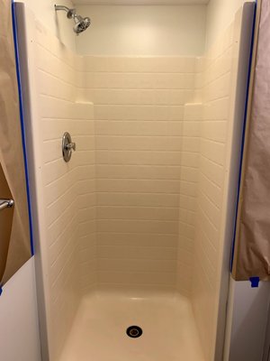 Stand Up Shower Refinishing - This stand up shower needed to be reglazed in gloss white. The surface was first cleaned with our step 1/step 2 cleaner, sanded down, prepped up, sprayed with 2 layers of primer and finally sprayed with 4 layers of top coat. Stand Up Shower Refinishing - This stand up shower needed to be reglazed in gloss white. The surface was first cleaned with our step 1/step 2 cleaner, sanded down, prepped up, sprayed with 2 layers of primer and finally sprayed with 4 layers of top coat.
