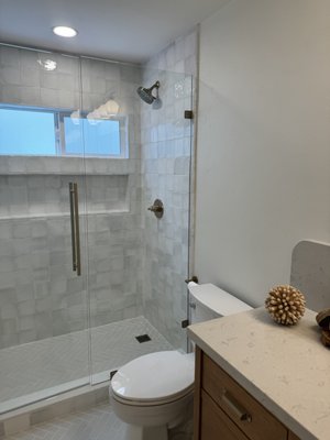 Bathroom remodeling 2024 Coronado - Teen Bathroom Transformation: Elegant & Modern 🌟🚿

We're so excited to reveal this fresh, chic update to our teen's bathroom! The walk-in shower features stunning White Mixed Finish Ceramic tile walls and a sleek custom glass door for a light, airy feel. We chose Gris Gray Matte Porcelain Subway tiles for the floor, bringing a modern, grounding contrast to the space.

The custom maple vanity with stylish gold handles adds a warm touch, and it is beautifully topped with a new quartz countertop. A brass gold faucet and a new sink complete the look, adding a luxe, polished feel. A perfect blend of function and style for our growing teen’s space! ✨