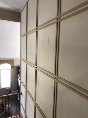 A grid accent wall over the stairs… - An accent wall with a plaid waynscotttinf. A grid accent wall over the stairs… - An accent wall with a plaid waynscotttinf.