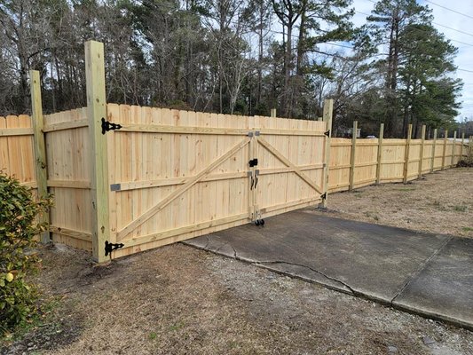 Fence Installation by Drop Zone Tree Service and Landscaping - PROJECT 1: Here's some pictures of a small privacy fence with a privacy wall in an apartment complex. 

PROJECT 2: Privacy fence install. Due to the high moisture content of the soil we opted to mount the 4x4's to metal footings. The customer intends to hang lattice on the remaining posts above the fenceline. 
As always, we use screws never nails. This fence will last for years to come!