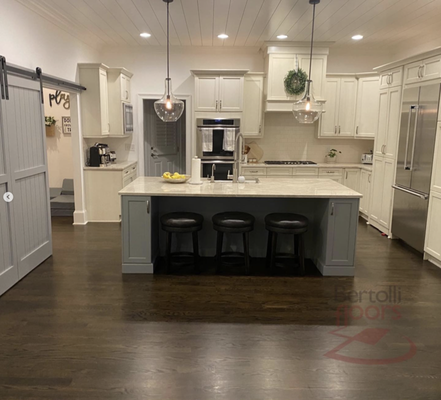 Kitchen & Living Room Floor Refinishing - Here we installed new flooring in this client's kitchen and living room. Kitchen & Living Room Floor Refinishing - Here we installed new flooring in this client's kitchen and living room.