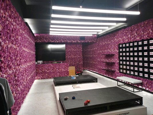 Custom decorations installation in a showroom - Another very custom order for a large company in NYC. Showroom had to be decorated with hundreds of artificial roses. The challenging part was to attach them to mirrors without using the screws. Task seemed to impossible to complete. But Alex found a creative solution in using special brackets in order to attach decorations to a glass surface. After 3 full days of work the end result looked gorgeous. Client left very happy with the work done by our team