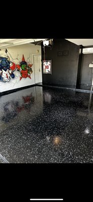 Epoxy floor - This garage floor was transformed with a full epoxy coating system to give it a clean, durable, and high-gloss finish. Proper prep work was completed before applying the coating and flake system to create a long-lasting finish that completely changed the look of the space. Epoxy floor - This garage floor was transformed with a full epoxy coating system to give it a clean, durable, and high-gloss finish. Proper prep work was completed before applying the coating and flake system to create a long-lasting finish that completely changed the look of the space.