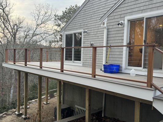 New deck construction - This project includes the complete construction of a custom outdoor deck built with premium TimberTech decking materials, selected for their durability, low maintenance, and long-lasting performance. The structure features a fully engineered framing system, precise layout, and expert installation to ensure a strong, level, and structurally sound outdoor living space.
In addition to the decking, we installed a premium cable railing system, providing a sleek, modern aesthetic while maintaining open views and meeting all safety requirements. The railing system was carefully integrated into the design for a clean, high-end finished appearance.
TimberTech composite decking offers superior resistance to weather, fading, and wear, making it an excellent choice for New England coastal conditions. Every detail was completed with precision, from board alignment to fastening systems, ensuring a smooth and professional finish.
The result is a durable, low-maintenance outdoor living space designed for entertaining, relaxation, and long-term enjoyment. New deck construction - This project includes the complete construction of a custom outdoor deck built with premium TimberTech decking materials, selected for their durability, low maintenance, and long-lasting performance. The structure features a fully engineered framing system, precise layout, and expert installation to ensure a strong, level, and structurally sound outdoor living space.
In addition to the decking, we installed a premium cable railing system, providing a sleek, modern aesthetic while maintaining open views and meeting all safety requirements. The railing system was carefully integrated into the design for a clean, high-end finished appearance.
TimberTech composite decking offers superior resistance to weather, fading, and wear, making it an excellent choice for New England coastal conditions. Every detail was completed with precision, from board alignment to fastening systems, ensuring a smooth and professional finish.
The result is a durable, low-maintenance outdoor living space designed for entertaining, relaxation, and long-term enjoyment.