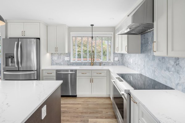 Timeless Kitchen Remodel - This was a stunning full kitchen remodel! We created clean design that meets subtle drama. The soft gray cabinets and that ocean-inspired backsplash add the perfect pop of color while keeping it timeless Timeless Kitchen Remodel - This was a stunning full kitchen remodel! We created clean design that meets subtle drama. The soft gray cabinets and that ocean-inspired backsplash add the perfect pop of color while keeping it timeless