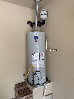 50 gallon Natural Gas Water Heater Replacement up to Code - This 50 gallon natural gas water heater replaced a 19 year old water heater with a cracked tank. The new water heater was brought up to code with a drain pan, sediment trap on the gas, new shutoff valve and supply lines, and an expansion tank to account for thermal expansion 50 gallon Natural Gas Water Heater Replacement up to Code - This 50 gallon natural gas water heater replaced a 19 year old water heater with a cracked tank. The new water heater was brought up to code with a drain pan, sediment trap on the gas, new shutoff valve and supply lines, and an expansion tank to account for thermal expansion