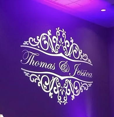 GOBO Monogram - A gobo monogram definitely provides that “wow” factor at your wedding or event. Imagine guests entering your ballroom to see your initials displayed in bright light on the dance floor or Wall. We can project your gobo, name/date/message, or company logo, relevant information or just about anything onto the dance floor, on a screen, or up against a wall or Dancfloor. (Please plan a designated area with enough space for the Dj to setup the Gobo Monogram Device. GOBO Monogram - A gobo monogram definitely provides that “wow” factor at your wedding or event. Imagine guests entering your ballroom to see your initials displayed in bright light on the dance floor or Wall. We can project your gobo, name/date/message, or company logo, relevant information or just about anything onto the dance floor, on a screen, or up against a wall or Dancfloor. (Please plan a designated area with enough space for the Dj to setup the Gobo Monogram Device.