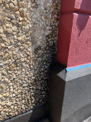 Dried Latex Paint on Rock Wall - Sumo Japanese Steakhouse recently got repainted. Some of the black paint unfortunately got onto one of their walls of rock! 
K&B Total Care tackled the problem with our pressure washing services and paint remover spray.