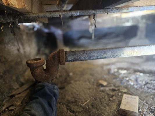 Pipe replacement underneath house for bathtub. - This job was to replace a broken/rotted pipe underneath the house. It was a galvanized 2"x1.5", installed a new ABS pipe and fittings.