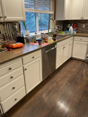 Dishwasher Leak - Dishwasher leaked causing damages to the kitchen cabinets, drywall and laminate flooring. Fortunately, we were able to save our customers countertops. This all started from our customers noticing a small water mark on their ceiling down below, directly underneath the kitchen.