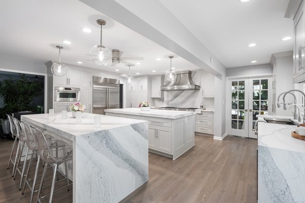 Kitchen Remodel in Northbrook – Open-Concept Luxury Double-Island Kitchen - A comprehensive open-concept transformation in Northbrook, IL, turning a traditional kitchen into a high-functioning culinary masterpiece. As a design-build company, our architectural designers reimagined the spatial flow under one point of accountability to accommodate dual functional islands, custom cabinetry, and seamless smart-home and appliance integration.
The space features custom double islands with a striking marble-look quartz waterfall edge, high-end inset cabinetry, a professional-grade Wolf double-oven range with a statement stainless steel hood, and fully integrated Sub-Zero refrigeration. We even designed a custom, integrated "Doggy Diner" feeding station built into the custom cabinetry run to accommodate active family life.
From design studio selections through structural construction, this layout was meticulously planned in 3D before demolition began. Backed by our 3-Year Labor Warranty. Schedule Your Design Consultation to discuss your layout goals. Kitchen Remodel in Northbrook – Open-Concept Luxury Double-Island Kitchen - A comprehensive open-concept transformation in Northbrook, IL, turning a traditional kitchen into a high-functioning culinary masterpiece. As a design-build company, our architectural designers reimagined the spatial flow under one point of accountability to accommodate dual functional islands, custom cabinetry, and seamless smart-home and appliance integration.
The space features custom double islands with a striking marble-look quartz waterfall edge, high-end inset cabinetry, a professional-grade Wolf double-oven range with a statement stainless steel hood, and fully integrated Sub-Zero refrigeration. We even designed a custom, integrated "Doggy Diner" feeding station built into the custom cabinetry run to accommodate active family life.
From design studio selections through structural construction, this layout was meticulously planned in 3D before demolition began. Backed by our 3-Year Labor Warranty. Schedule Your Design Consultation to discuss your layout goals.