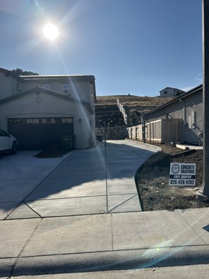 Driveway Replacement - This driveway developed plenty of wear and tear over the years, so we replaced it with a thicker section of concrete with steel to prevent the cracks from happening in the future.