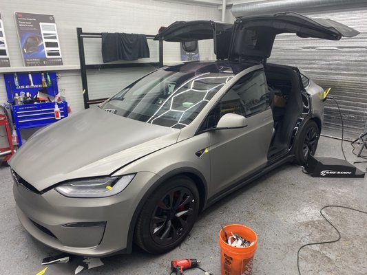 Tesla Model X Vinyl Wrap - Tesla Model X Plaid vinyl wrap with 3M brushed titanium. Tesla Model X Vinyl Wrap - Tesla Model X Plaid vinyl wrap with 3M brushed titanium.
