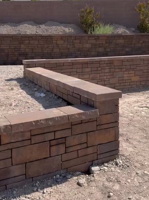 Crafted Block wall using high-quality earth tone blocks! - This block wall and matching staircase was created for a backyard to elevate their space! Using earth tone blocks, it visually connects with any landscape, while also adding different levels to add more aesthetics. Crafted Block wall using high-quality earth tone blocks! - This block wall and matching staircase was created for a backyard to elevate their space! Using earth tone blocks, it visually connects with any landscape, while also adding different levels to add more aesthetics.