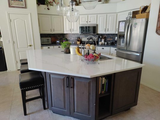 Kitchen Remodel - This remodel was done on a kitchen that just needed some upgrades and a fresh modern look. Bright white cabinets brought this kitchen to life and made it stand out from the previous brown basic cabinetry. Peep the statement backsplash! The contrast of the colors is to die for! We also added a lively dry bar for the client to replace the clients tiny bar counter. Kitchen Remodel - This remodel was done on a kitchen that just needed some upgrades and a fresh modern look. Bright white cabinets brought this kitchen to life and made it stand out from the previous brown basic cabinetry. Peep the statement backsplash! The contrast of the colors is to die for! We also added a lively dry bar for the client to replace the clients tiny bar counter.