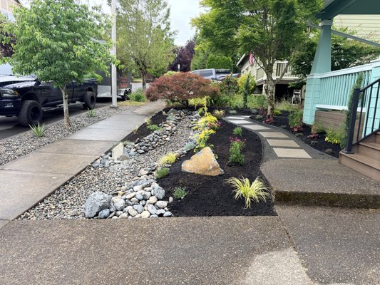 Landscape Design - The landscape had a beautiful transformation with a new dry creek installation, pathway, new plants, and mulch installation. Landscape Design - The landscape had a beautiful transformation with a new dry creek installation, pathway, new plants, and mulch installation.