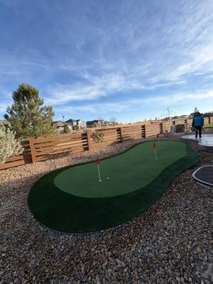 Backyard Putting Green - This custom putting green brings a fun, functional feature to the backyard while keeping the space clean and easy to maintain. Designed to blend naturally into the yard, it creates the perfect spot to practice, relax, and enjoy the outdoors. Backyard Putting Green - This custom putting green brings a fun, functional feature to the backyard while keeping the space clean and easy to maintain. Designed to blend naturally into the yard, it creates the perfect spot to practice, relax, and enjoy the outdoors.