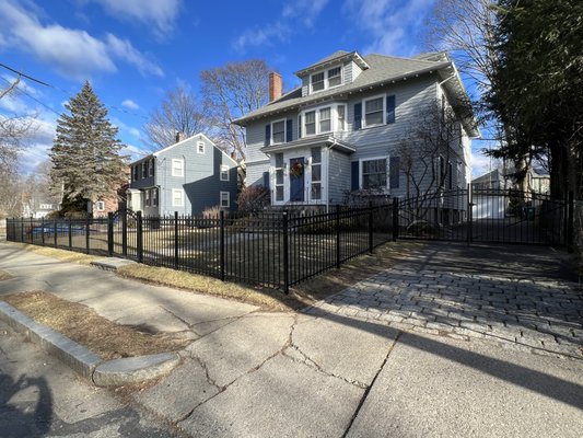 Black Aluminum fence in Newton - Black alumium fence with rings for the front yard and cedar privacy board fence for the back yard.
