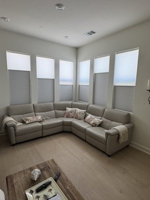 Day / Night Honeycomb shades in Rancho Bernardo - San Diego - Day & Night Motorized Honeycomb Shades Installation in Rancho Bernardo, San Diego
This Rancho Bernardo project featured the installation of custom motorized Day & Night honeycomb shades designed to provide the homeowner with the ultimate combination of privacy, light control, energy efficiency, and convenience. The goal was to create a flexible window treatment solution that could adapt to different lighting conditions throughout the day while maintaining a clean, modern appearance that complemented the home's interior design.
One of the biggest challenges many homeowners face is choosing between light-filtering shades that allow natural daylight into the room and blackout shades that provide complete privacy and room darkening. With traditional window coverings, homeowners often have to compromise. For this project, we recommended Day & Night cellular shades, which combine both light-filtering and blackout fabrics into a single shade system.
During the day, the homeowner can position the light-filtering portion of the shade to enjoy beautiful natural sunlight while maintaining privacy from neighboring homes. The soft-filtering fabric helps reduce glare and harsh sunlight while creating a bright and inviting atmosphere. In the evening, or whenever complete darkness is desired, the blackout section can be lowered to block outside light and provide maximum privacy. The ability to position the shades anywhere in between gives the homeowner complete control over the amount of light entering the room throughout the day.
In addition to their versatility, honeycomb shades are one of the most energy-efficient window treatment options available. The cellular construction creates insulating air pockets that help reduce heat transfer through the windows. This can improve indoor comfort, reduce solar heat gain during San Diego's warmer months, and help maintain a more consistent indoor temperature year-round. The shades also help reduce glare on televisions, computer screens, and other electronic devices while protecting furniture and flooring from harmful UV exposure.
To maximize convenience, the shades were equipped with motorization, allowing effortless operation with the touch of a button. Motorized honeycomb shades are especially popular in modern homes because they eliminate cords, provide a clean appearance, and can be integrated into smart home systems for scheduled operation. The homeowner can easily adjust multiple shades simultaneously, improving both comfort and energy efficiency throughout the day.