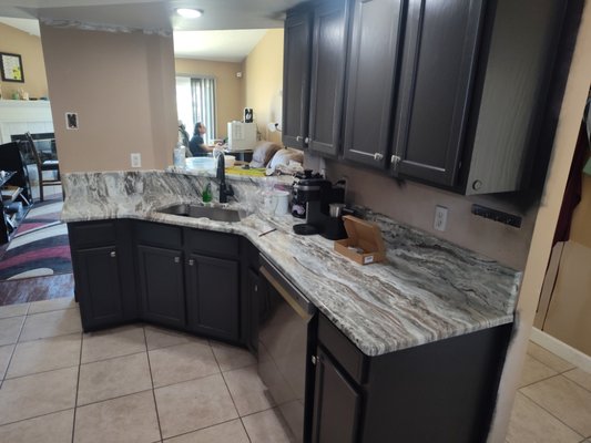 kitchen & bathroom cabinets - Befores and Afters of a beautiful job well done. We completely transformed these kitchen and bathroom cabinets 

Sherwin-Williams 
Sher-wood color express satin (riverbed)