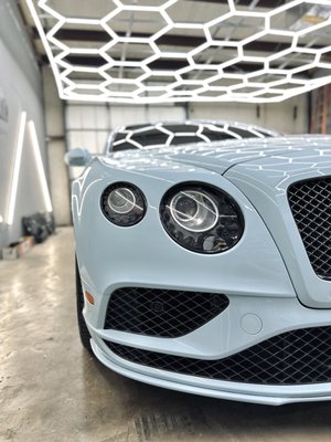 Beautiful Bentley Wrap - Welcome to our premium wrap shop, where automotive dreams come to life! Our skilled team recently transformed a sleek Bentley from its original grayish-black hue into a stunning masterpiece in Bali Blue. Picture the elegance of this deep, vibrant shade enveloping the Bentley, enhancing its curves and contours. The transformation not only adds a touch of luxury but also ensures that your Bentley stands out in style. Our attention to detail and commitment to quality guarantee a flawless finish, making your ride a true head-turner on the road. Experience the epitome of automotive customization with our Bali Blue wrap, turning ordinary into extraordinary. Beautiful Bentley Wrap - Welcome to our premium wrap shop, where automotive dreams come to life! Our skilled team recently transformed a sleek Bentley from its original grayish-black hue into a stunning masterpiece in Bali Blue. Picture the elegance of this deep, vibrant shade enveloping the Bentley, enhancing its curves and contours. The transformation not only adds a touch of luxury but also ensures that your Bentley stands out in style. Our attention to detail and commitment to quality guarantee a flawless finish, making your ride a true head-turner on the road. Experience the epitome of automotive customization with our Bali Blue wrap, turning ordinary into extraordinary.