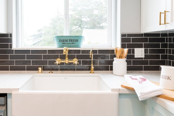 La Canada Project - This home was built in 1949 and, delightfully, the kitchen was original. One could imagine the possibilities for transformation from simply walking into this home. It was such a joy to creatively run wild with this project while also keeping the integrity of the era. Two-tone cabinets and a dark-gray backsplash tile were selected, to contrast beautifully with the light-tones throughout. The 1950’s flair surely came through with wall-mounted brass plumbing fixtures, baby-blue vintage fridge, farm-style sink and the restoration of the client’s antique stove. The end result was nothing short of charming. La Canada Project - This home was built in 1949 and, delightfully, the kitchen was original. One could imagine the possibilities for transformation from simply walking into this home. It was such a joy to creatively run wild with this project while also keeping the integrity of the era. Two-tone cabinets and a dark-gray backsplash tile were selected, to contrast beautifully with the light-tones throughout. The 1950’s flair surely came through with wall-mounted brass plumbing fixtures, baby-blue vintage fridge, farm-style sink and the restoration of the client’s antique stove. The end result was nothing short of charming.