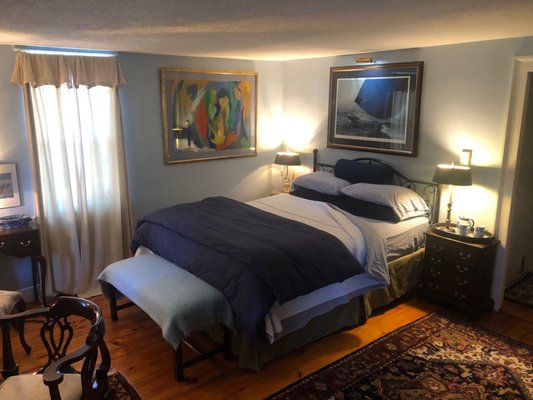 The Newport Suite - This spacious 2nd-floor suite offers two seperate bedrooms sharing a private bath. The nautical Blue Room located on the southeast corner offers a queen bed, a large mahogany desk, two comfortable wing chairs, and  walnut bureau. The luxurious Pink room of this suite rests on the Southwest corner of the house opposite the Blue room. It offers guests two Windsor twin beds, a curved French bureau, two French chairs, and a closet. The room features original wide, "pumpkin" pine floors, and sunny windows overlooking gardens. WiFi and a refrigerator are available in all suites!