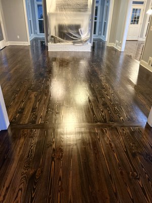 Hardwood flooring Restoration - Main level of a house about 1200 sq ft. pine wood sand & finish with the removal of carpets in the family room & installation of 400 sq ft of pine wood unfinished. We sanded the other 800 sq ft of old pine wood & repaired, stained & finished it all to make them look like brand new hard wood floors. Hardwood flooring Restoration - Main level of a house about 1200 sq ft. pine wood sand & finish with the removal of carpets in the family room & installation of 400 sq ft of pine wood unfinished. We sanded the other 800 sq ft of old pine wood & repaired, stained & finished it all to make them look like brand new hard wood floors.
