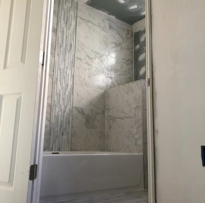 Shower Remodel - Shower remodel - 12x24 stacked pattern - tub enclosure - 1 pie shelf - custom glass chase Shower Remodel - Shower remodel - 12x24 stacked pattern - tub enclosure - 1 pie shelf - custom glass chase