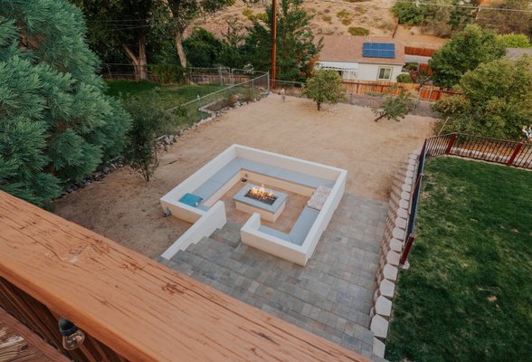 Exclusive Sunken Fire Pit Oasis with Elegant Paver Patio by Longhorn - Introducing our signature creation: a bespoke Sunken Fire Pit that defines luxury outdoor living, exclusively offered by Longhorn. This project takes outdoor design to unprecedented levels, featuring a cozy, inviting sunken fire pit area, accessible by elegantly designed steps that lead down into a secluded gathering space. This architectural marvel is complemented by a surrounding paver patio, which adds to the ambiance of warmth and welcome. Our unique sunken fire pit design creates a captivating outdoor living area that naturally becomes the heart of backyard gatherings, offering an unmatched experience of comfort and style. As the only company in town that specializes in this style of fire pit, Longhorn is proud to offer a feature that not only enhances the beauty of your outdoor space but also provides a distinctive, cozy retreat for enjoying the outdoors. Discover how our expertise in creating one-of-a-kind outdoor spaces can transform your backyard into a welcoming haven, perfect for relaxation and entertainment Exclusive Sunken Fire Pit Oasis with Elegant Paver Patio by Longhorn - Introducing our signature creation: a bespoke Sunken Fire Pit that defines luxury outdoor living, exclusively offered by Longhorn. This project takes outdoor design to unprecedented levels, featuring a cozy, inviting sunken fire pit area, accessible by elegantly designed steps that lead down into a secluded gathering space. This architectural marvel is complemented by a surrounding paver patio, which adds to the ambiance of warmth and welcome. Our unique sunken fire pit design creates a captivating outdoor living area that naturally becomes the heart of backyard gatherings, offering an unmatched experience of comfort and style. As the only company in town that specializes in this style of fire pit, Longhorn is proud to offer a feature that not only enhances the beauty of your outdoor space but also provides a distinctive, cozy retreat for enjoying the outdoors. Discover how our expertise in creating one-of-a-kind outdoor spaces can transform your backyard into a welcoming haven, perfect for relaxation and entertainment